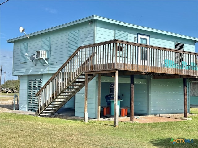 back of house featuring a yard and a wooden deck