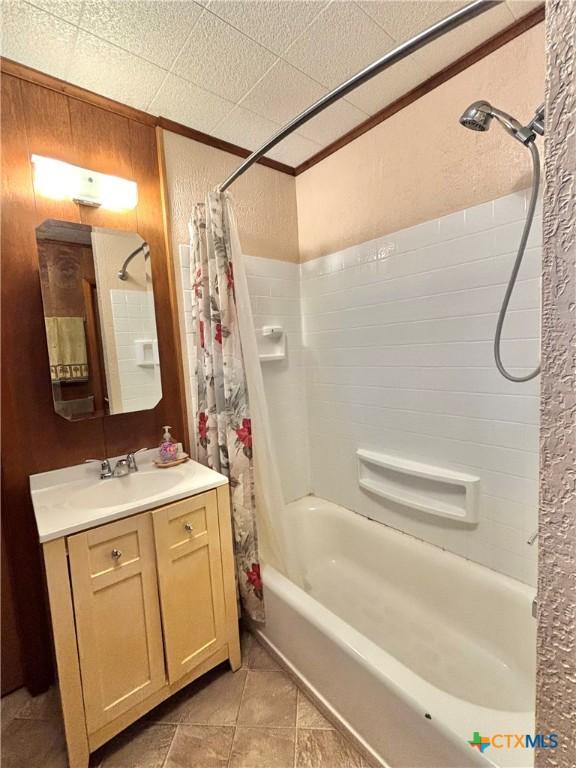 bathroom with shower / tub combo and vanity