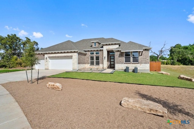 view of front facade with a front lawn and a garage