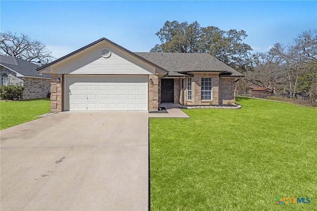 ranch-style home featuring a front yard, concrete driveway, brick siding, and an attached garage