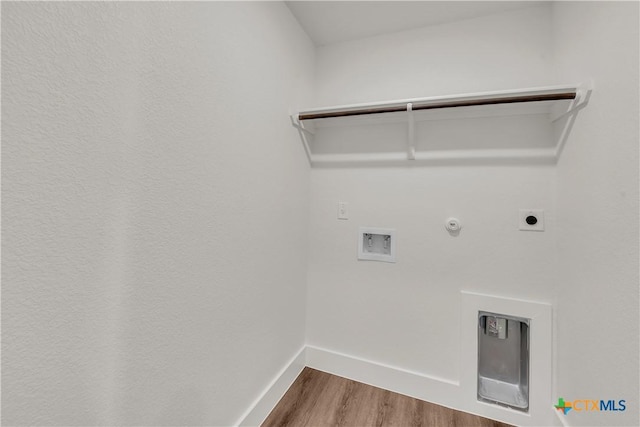 clothes washing area with hookup for a gas dryer, hookup for a washing machine, hardwood / wood-style floors, and electric dryer hookup