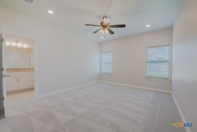 carpeted empty room with ceiling fan