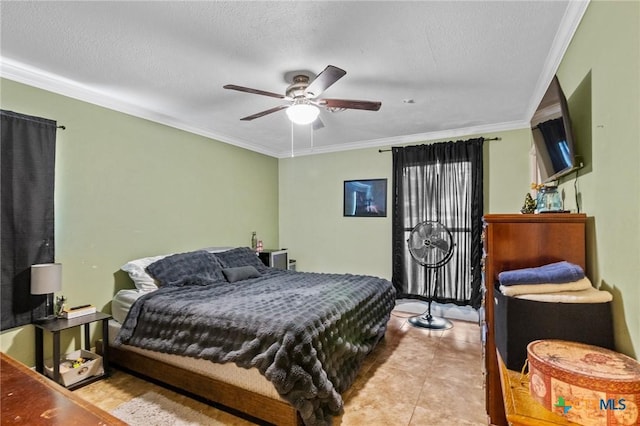 203 Yorkshire Ln, Victoria, TX 77904 - tiled bedroom with ornamental molding, ceiling fan, and a textured ceiling