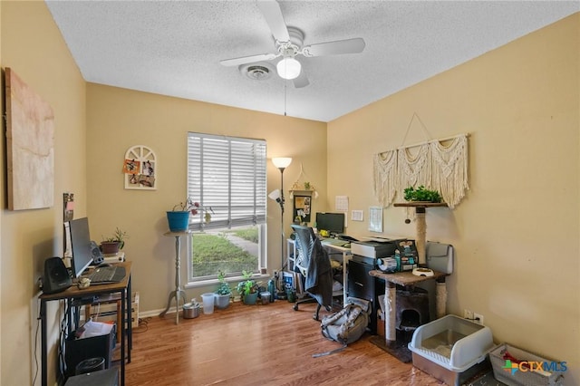 203 Yorkshire Ln, Victoria, TX 77904 - office featuring a ceiling fan, wood finished floors, and a textured ceiling