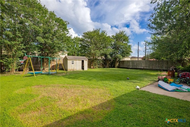 203 Yorkshire Ln, Victoria, TX 77904 - fenced backyard featuring a storage shed and a playground