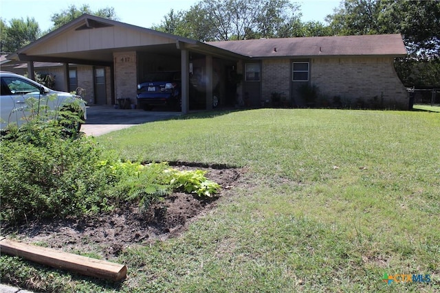 single story home with a front yard, a carport, brick siding, and driveway