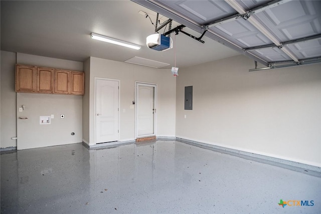 garage featuring electric panel and a garage door opener