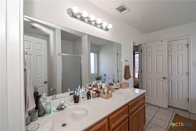 full bath featuring tile patterned floors, visible vents, a sink, a shower stall, and a bath