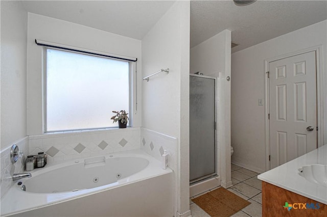 full bathroom featuring tile patterned flooring, toilet, vanity, a jetted tub, and a shower stall