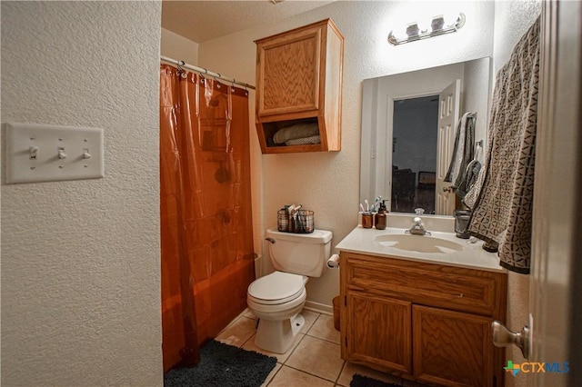 full bath with a textured wall, toilet, vanity, tile patterned floors, and shower / bath combo