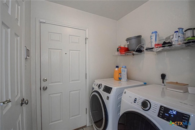 clothes washing area with laundry area and washing machine and dryer