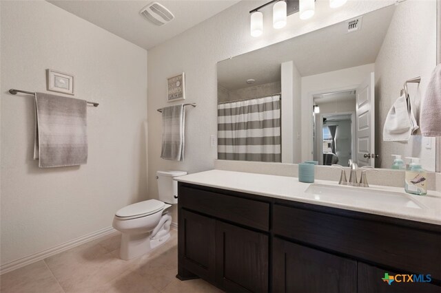 3301 Amerigo Pl, Round Rock, TX 78665 - full bathroom featuring toilet, vanity, tile patterned flooring, baseboards, and a shower with curtain