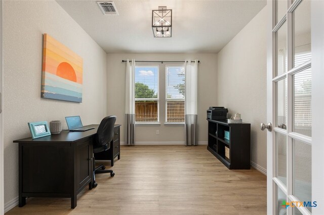 3301 Amerigo Pl, Round Rock, TX 78665 - home office with light wood-style flooring and baseboards