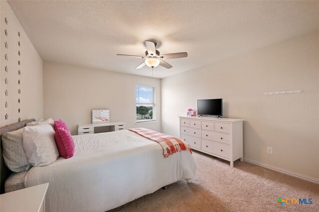 3301 Amerigo Pl, Round Rock, TX 78665 - bedroom featuring light carpet, a ceiling fan, and baseboards