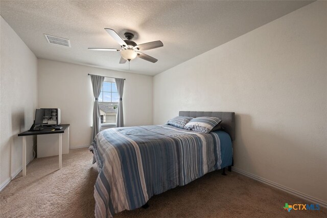 3301 Amerigo Pl, Round Rock, TX 78665 - carpeted bedroom featuring baseboards, a textured ceiling, and ceiling fan