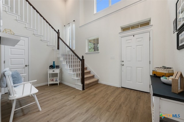 3301 Amerigo Pl, Round Rock, TX 78665 - entrance foyer featuring a high ceiling, light wood-style floors, stairway, and baseboards