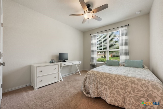 3301 Amerigo Pl, Round Rock, TX 78665 - carpeted bedroom with a desk, baseboards, and ceiling fan