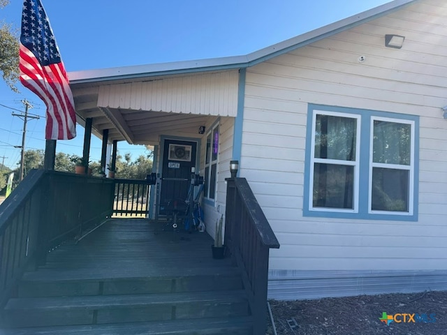 doorway to property with a porch