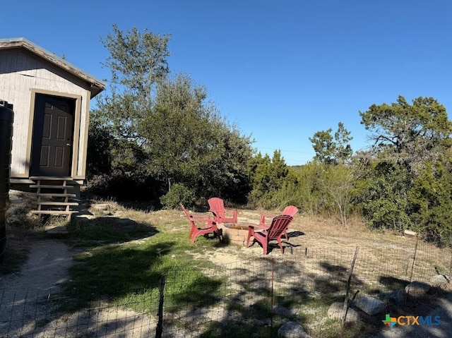 view of yard featuring a fire pit