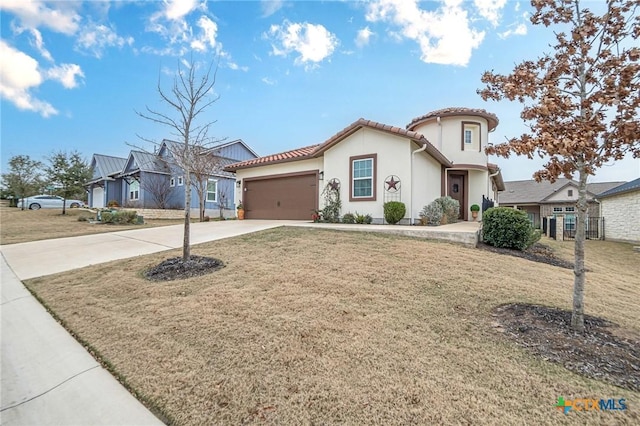 view of front facade featuring an attached garage, driveway, a tiled roof, stucco siding, and a front lawn