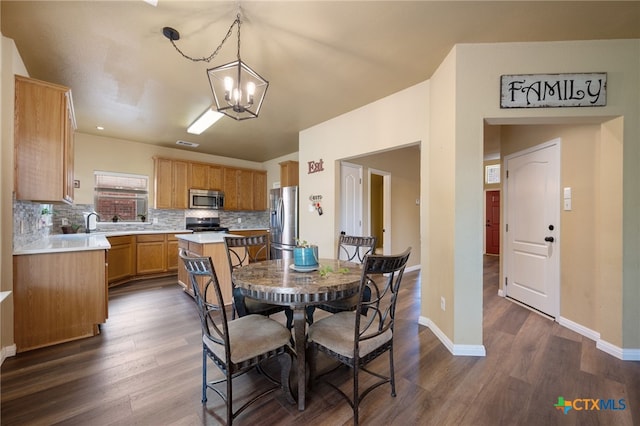 3416 Winding Shore Ln, Pflugerville, TX 78660 - dining area featuring a chandelier and dark wood finished floors
