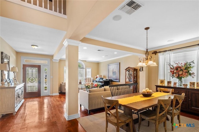 204 Edgewater, Victoria, TX 77904 - dining space with decorative columns, wood finished floors, and ornamental molding