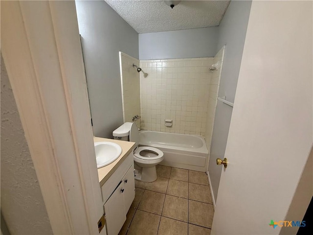 2102 Spicewood Dr, Killeen, TX 76543 - full bath featuring a textured ceiling, vanity, tile patterned flooring, and shower / bathtub combination