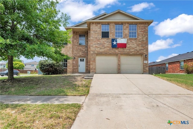 508 Taurus Dr, Killeen, TX 76542 - traditional-style home featuring driveway, a garage, brick siding, and a front lawn