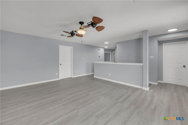 508 Taurus Dr, Killeen, TX 76542 - unfurnished living room featuring ceiling fan, baseboards, wood finished floors, and recessed lighting