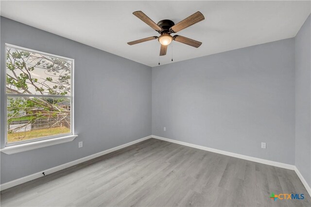508 Taurus Dr, Killeen, TX 76542 - empty room featuring wood finished floors, baseboards, and a ceiling fan