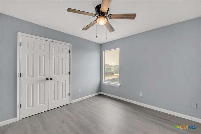508 Taurus Dr, Killeen, TX 76542 - unfurnished bedroom featuring wood finished floors, a closet, and baseboards