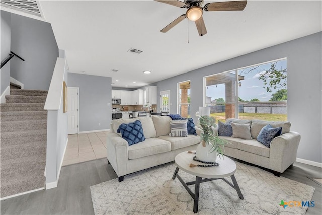 508 Taurus Dr, Killeen, TX 76542 - living room featuring baseboards, light wood-style floors, stairway, ceiling fan, and recessed lighting