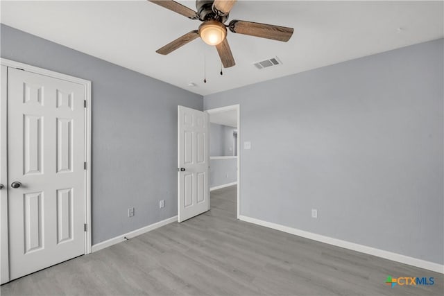 508 Taurus Dr, Killeen, TX 76542 - unfurnished bedroom featuring baseboards, wood finished floors, and a ceiling fan