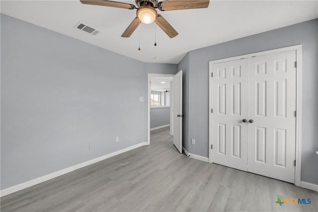 508 Taurus Dr, Killeen, TX 76542 - unfurnished bedroom with light wood finished floors, baseboards, a closet, and ceiling fan