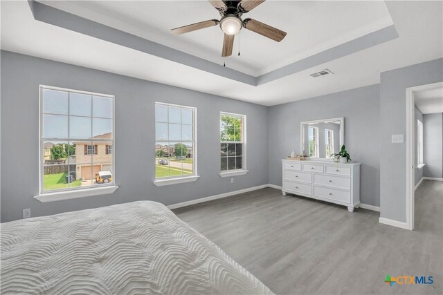 508 Taurus Dr, Killeen, TX 76542 - bedroom with a raised ceiling, wood finished floors, baseboards, and a ceiling fan