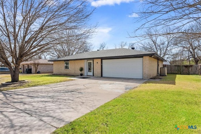 single story home featuring a garage, driveway, fence, a front yard, and brick siding