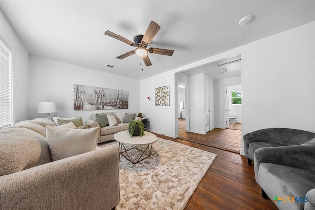 1304 E French Ave, Temple, TX 76501 - living room featuring wood finished floors, ceiling fan, and baseboards