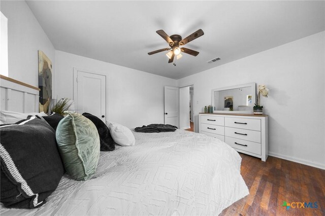 1304 E French Ave, Temple, TX 76501 - bedroom with baseboards, dark wood-type flooring, and ceiling fan