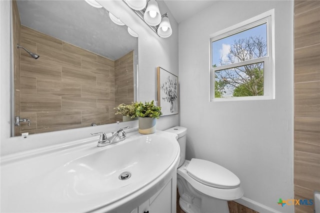 1304 E French Ave, Temple, TX 76501 - bathroom featuring vanity, toilet, and a shower