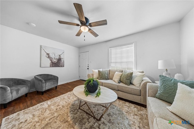 1304 E French Ave, Temple, TX 76501 - living room featuring a ceiling fan, wood finished floors, and baseboards