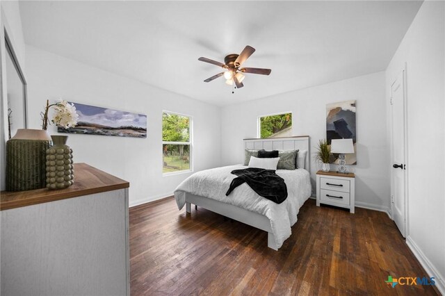 1304 E French Ave, Temple, TX 76501 - bedroom featuring baseboards, dark wood-type flooring, and a ceiling fan