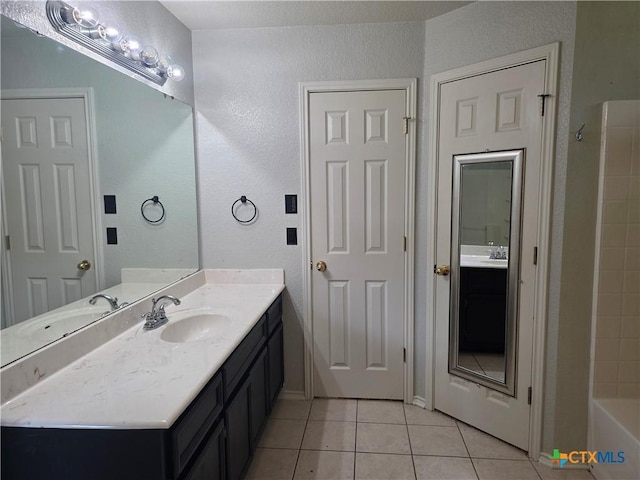 2803 Lindsey Dr, Copperas Cove, TX 76522 - full bath with tile patterned floors, vanity, a textured wall, and shower / bath combination