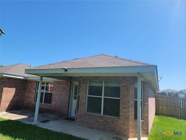 2803 Lindsey Dr, Copperas Cove, TX 76522 - rear view of property featuring brick siding and a patio
