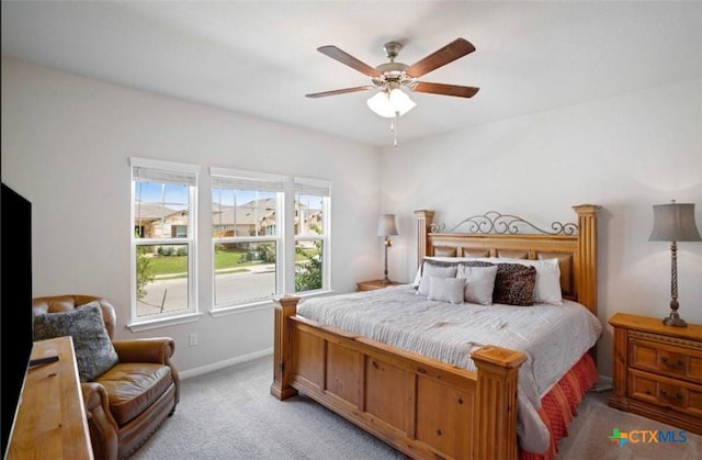 225 Horsemint Way, San Marcos, TX 78666 - bedroom featuring light carpet, baseboards, and ceiling fan