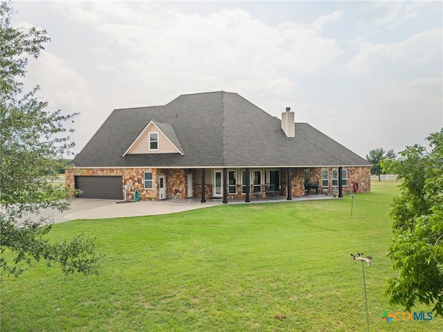 rear view of property with a yard