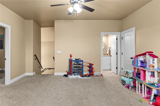 playroom with carpet and ceiling fan