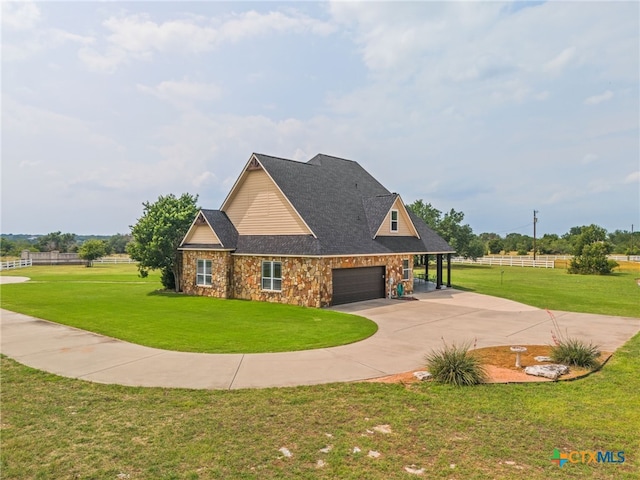 craftsman-style house featuring a front yard and a garage