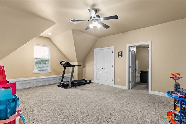 exercise room featuring carpet, lofted ceiling, and ceiling fan