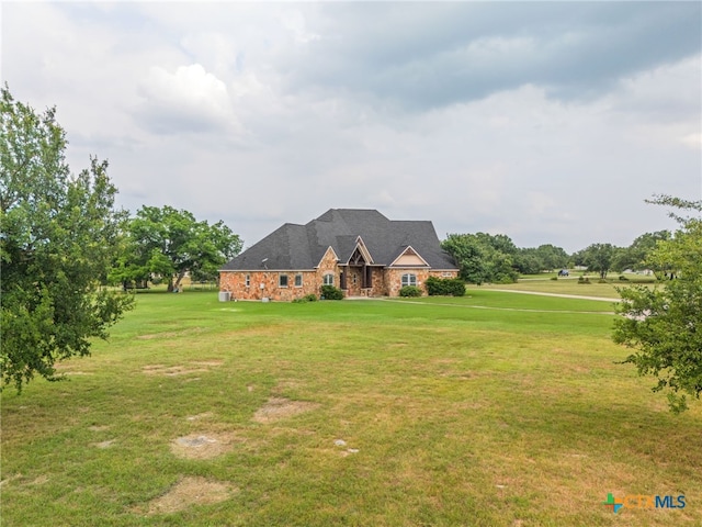 view of front of property with a front lawn