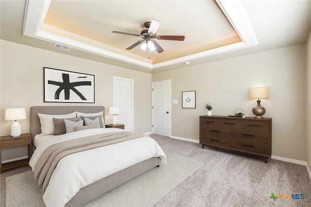 1617 Shadow Canyon Dr, Temple, TX 76502 - bedroom with a raised ceiling, light carpet, and ceiling fan